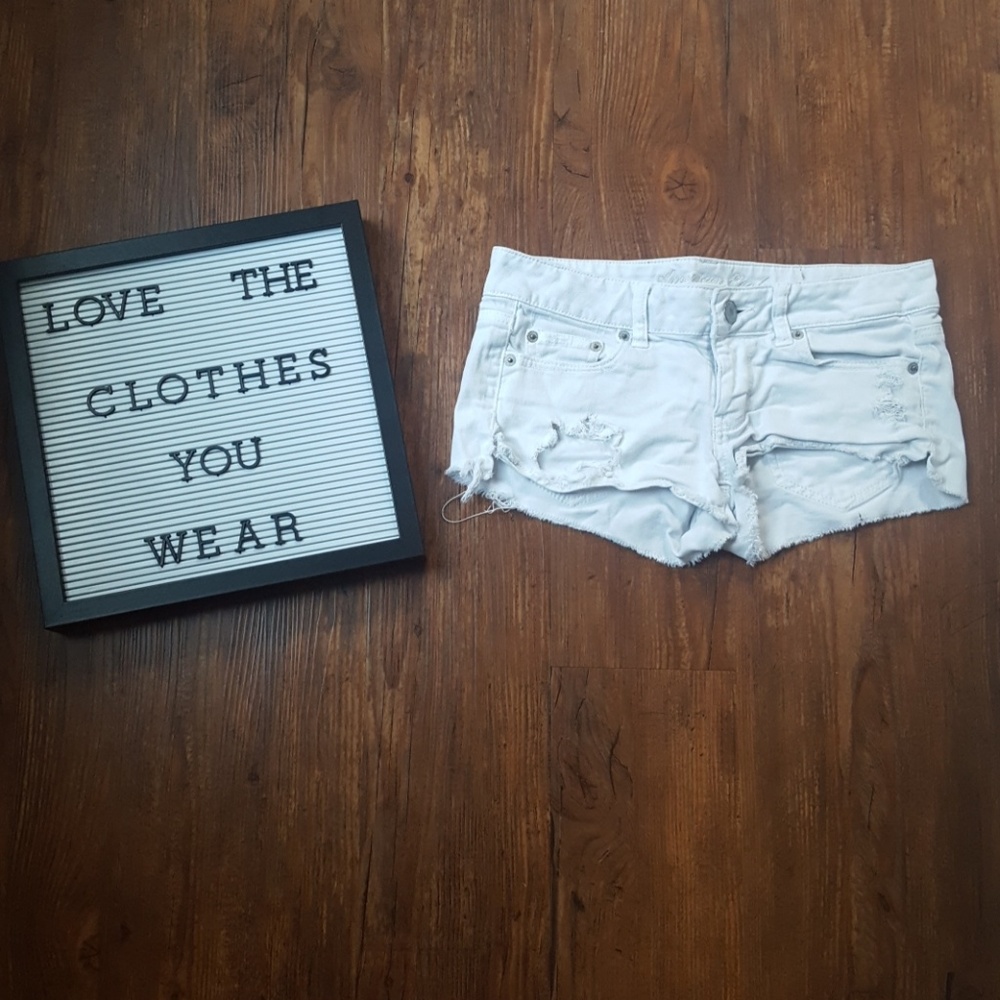 White distressed american eagle shorts
